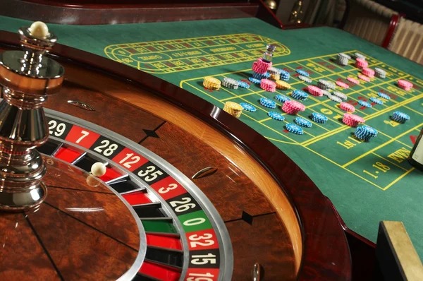 Playtech live-dealer studio with dealer and gaming table